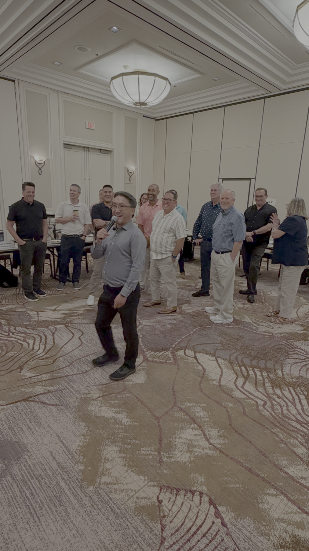 Stuart Takehara leads a lively icebreaker with board members during an annual strategic planning retreat