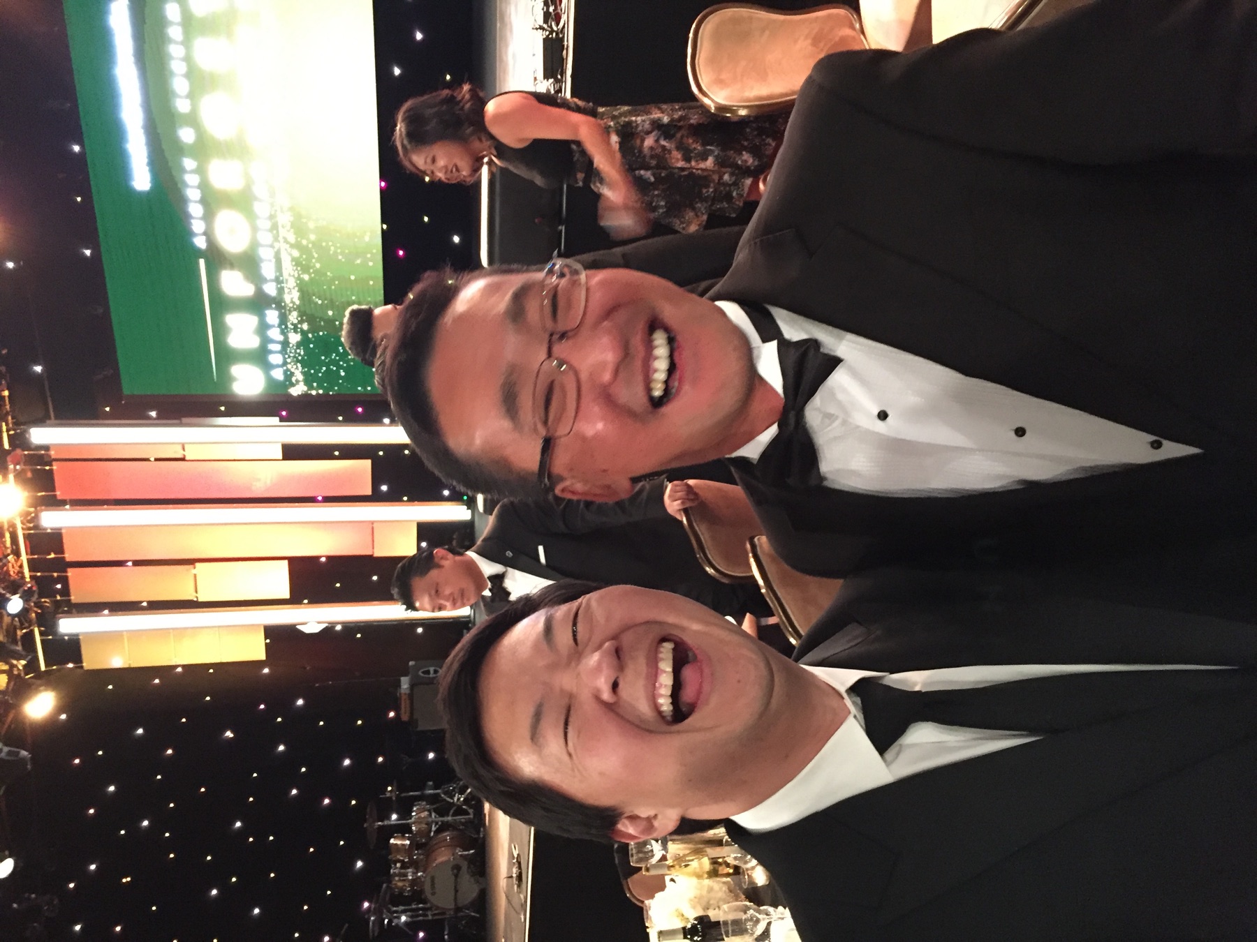Stuart Takehara with a colleague at a formal community event