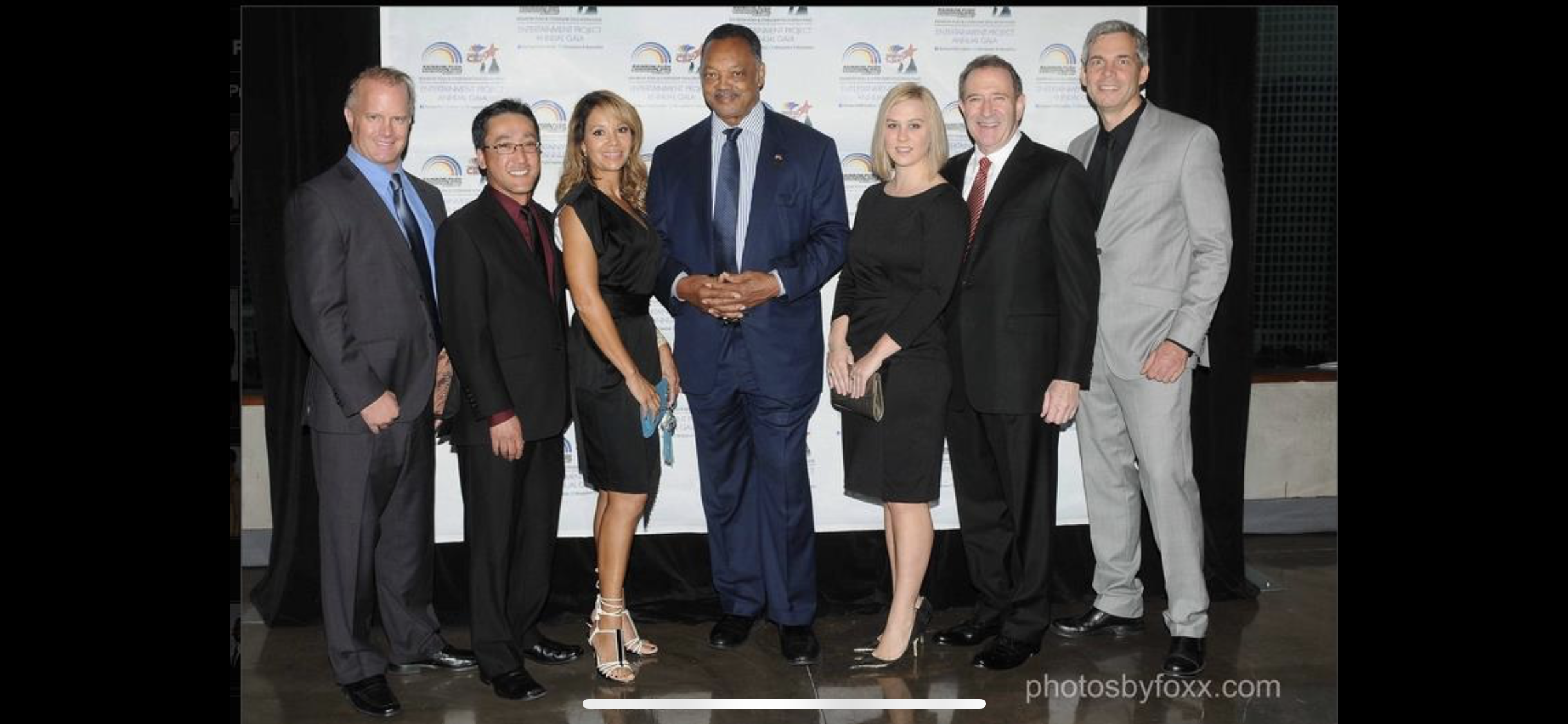 Stuart Takehara with community and business leaders at a public event